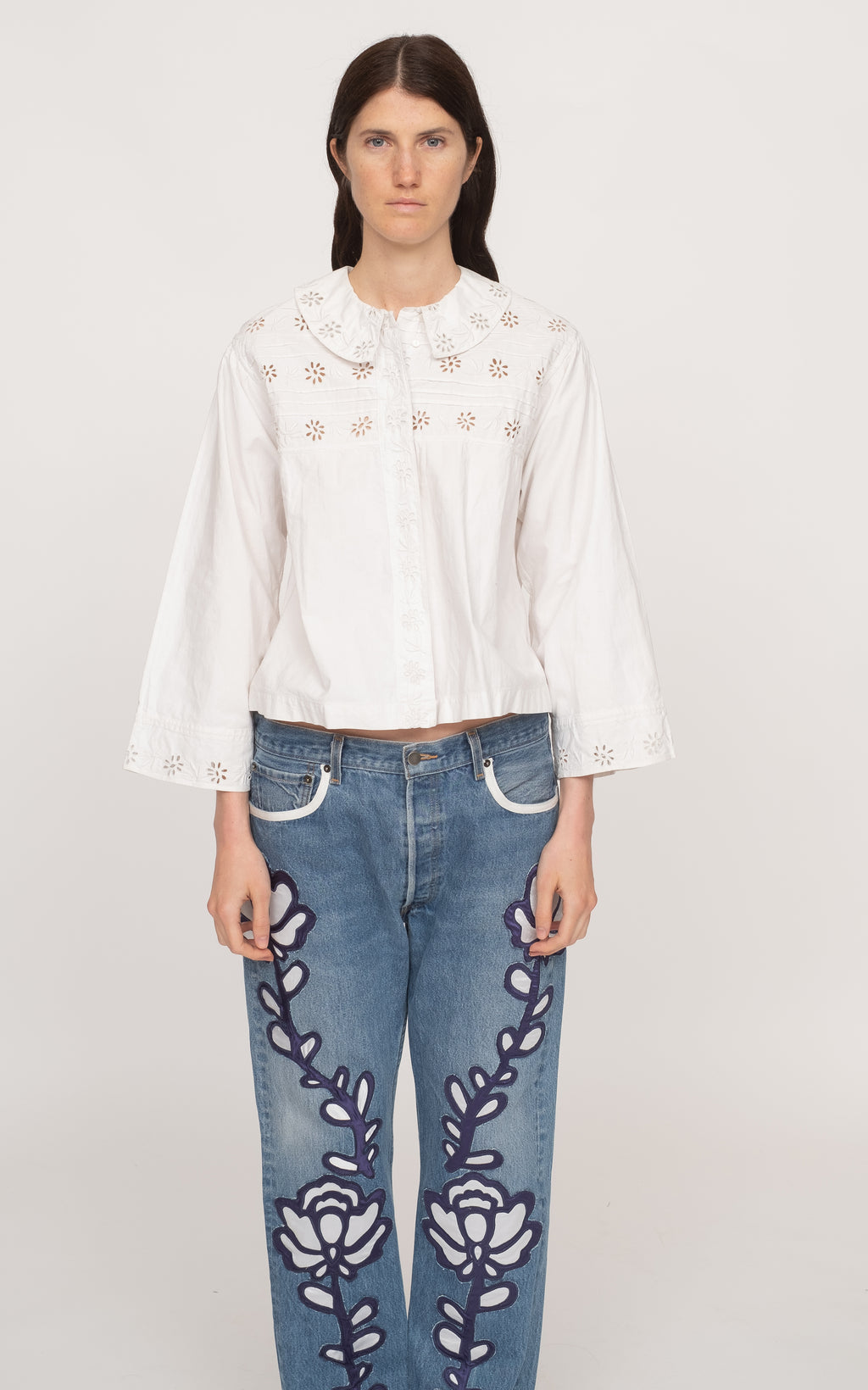 The Paloma top is a must-have for any fashion-forward wardrobe. Made from 100% cotton, this top boasts intricate eyelet trim detailing and flattering bell sleeves. With a classic button front, it's perfect for any occasion. Elevate your style with the Paloma top.