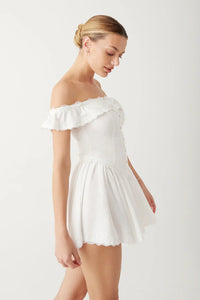 Elevate your evening look with the Charli Mini Dress. Made of silk-like fabric, this off-the-shoulder dress features a smocked back and corset waist for a sultry silhouette. Vintage-inspired lace accents and lace trim add a touch of elegance, while the elastic neckline ensures a comfortable fit. Perfect for any special occasion.