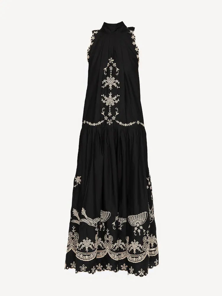 The Kingsley embroidered tank dress by SEA NY showcases intricate embroidery throughout its design, offering a refined and elegant appeal. It features a high neckline that adds a sophisticated touch, complemented by a delicate back bow tie for adjustable fit and added charm. The scalloped hemline enhances the dress's feminine silhouette, making it an exceptional choice for those seeking a polished yet distinctive look.