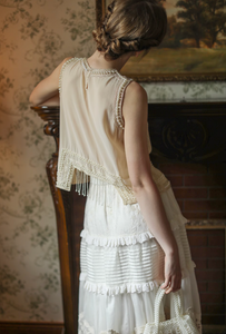 Introducing the Keira Blouse, the perfect choice for any fashionable woman looking to elevate her style. This elegant top features delicate handmade beading and a loose fit for a chic Mori Kei aesthetic. Exude effortless charm and stand out from the crowd with the Keira Blouse.