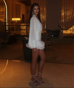 Elevate your wardrobe with the Melrose Shirt Dress, a refined dress featuring a backless blouse with a matching mini skirt. The blouse highlights a V-neckline and long lantern sleeves, adding a delicate yet striking touch. The accompanying A-line skirt offers a flattering silhouette, perfect for both day and evening occasions. This ensemble blends modern elegance with timeless charm, making it a sophisticated choice for confident women.
