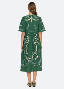 Elevate your wardrobe with the Vesna Embroidered Midi Dress by SEA NY, featuring delicate embroidery and scalloped trim for a refined finish. Its crew neckline and short sleeves complement the flattering A-line silhouette, while the hem gracefully falls below the knee. The back tie closure offers a tailored fit, combining elegance with comfort. Crafted from a cotton, linen, and polyester blend, this dress is best maintained with dry cleaning to preserve its quality. Perfect for sophisticated occasions.