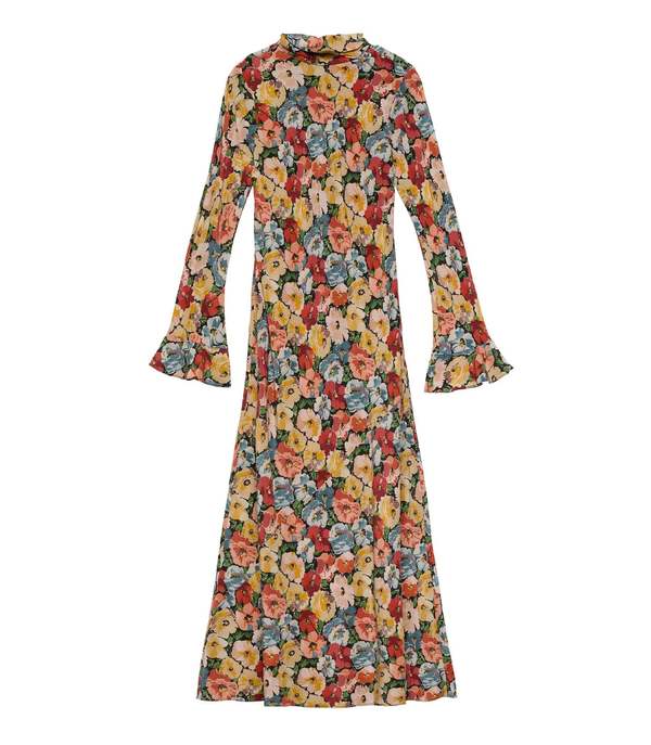 Crafted from washed silk crepe de chine, the Musetta Dress in Poppy Meadow by Doen combines elegance with refined tailoring. It features a sophisticated mock neck and dramatic flared sleeves finished with delicate ruffle trims at the cuffs. The fitted bodice, enhanced by an invisible side zipper, seamlessly flows into an ankle-grazing bias-cut skirt, ensuring a flattering silhouette and graceful movement. Ideal for those seeking timeless style with subtle, expert detailing.