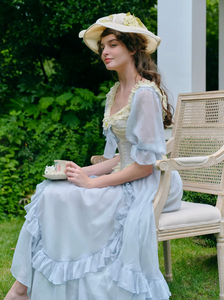 Introducing the Elora Dress - a vintage-inspired, slimming maxi dress in a sophisticated fishbone blue. With delicate lace accents and a seductive V-neck, this dress is perfect for summer parties and birthdays. Channel elegance and sexiness with every step in this exclusive piece.