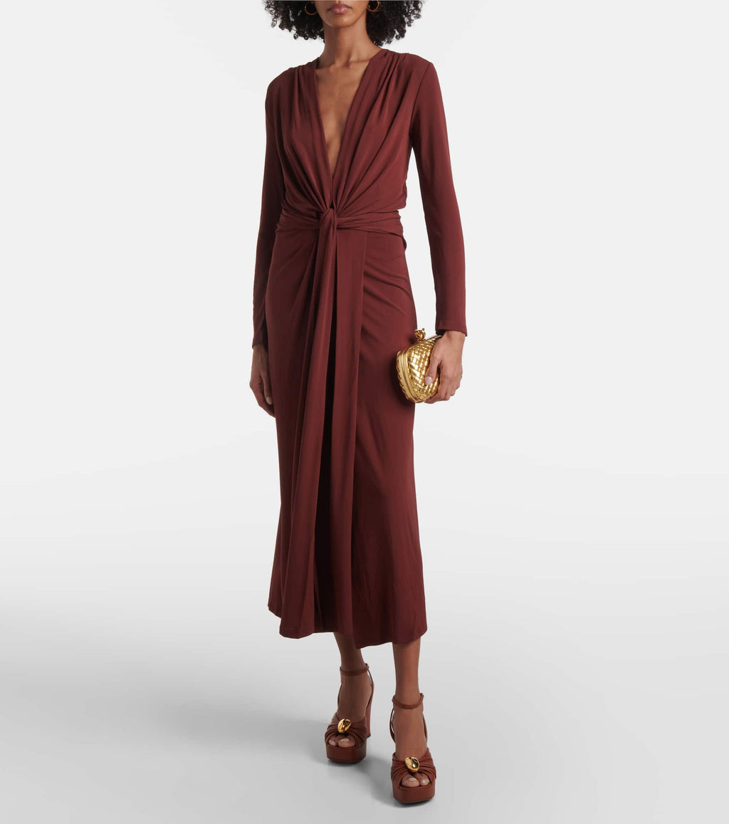 Elevate your wardrobe with the Finding Yourself draped jersey maxi dress by Johanna Ortiz. Crafted from soft, flowing jersey fabric, this dress features elegant draping that enhances silhouette and movement. Its maxi length offers refined sophistication, perfect for both daytime elegance and evening occasions. Designed for comfort without sacrificing style, this piece seamlessly blends timeless grace with modern ease.