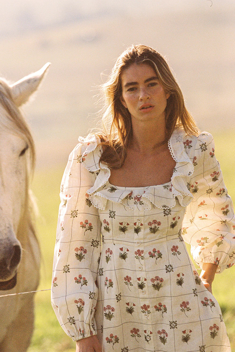 The Montana Dress in our exclusive Flower Ceramics print is expertly crafted from premium linen, combining comfort with refined style. It features a fitted bust and waist that enhance your silhouette, flowing into an elegant A-line skirt. The design includes subtle mock center-front button detailing, full-length sleeves, and a carefully tailored square neckline for a sophisticated finish. Consult our size and fit guide to ensure the perfect fit tailored to your measurements.