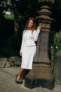 Experience timeless elegance with The Slip Set, a slip skirt and cardigan thoughtfully redesigned for everyday ease and flirtatious charm. Crafted for movement, it features a delicate flounce hem and scalloped picot trim that add subtle texture, while the petite baby bow at the center front offers a refined finishing touch. This pull-on skirt and top combines classic sophistication with effortless comfort, making it an ideal choice for dressing up or down with confidence.