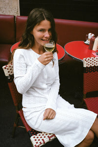 Experience timeless elegance with The Slip Set, a slip skirt and cardigan thoughtfully redesigned for everyday ease and flirtatious charm. Crafted for movement, it features a delicate flounce hem and scalloped picot trim that add subtle texture, while the petite baby bow at the center front offers a refined finishing touch. This pull-on skirt and top combines classic sophistication with effortless comfort, making it an ideal choice for dressing up or down with confidence.