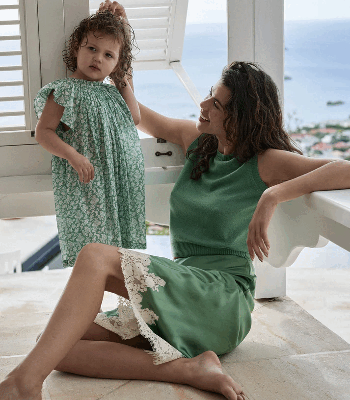Crafted from buttery silk satin, the Elowena Skirt in Peridot by Doen offers a sophisticated silhouette with a high waist accented by elastic scallop trim for added comfort and subtle texture. Its flowing bias cut ensures graceful movement, while the detailed contrast floral lace at the hem elevates the design with refined elegance. Ideal for pairing with the Kira Top, this skirt merges classic craftsmanship with contemporary style for a polished, expert look.