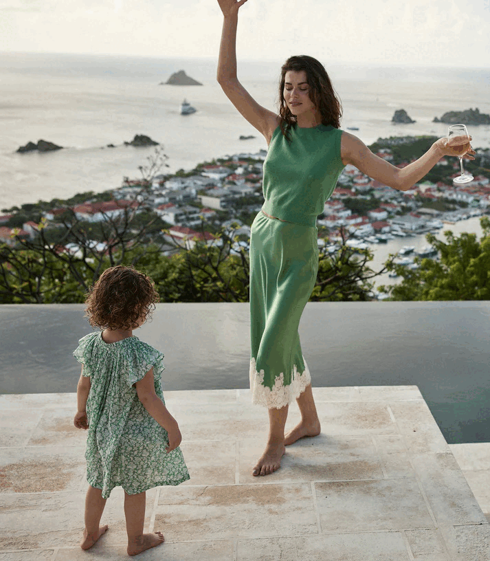 Crafted from buttery silk satin, the Elowena Skirt in Peridot by Doen offers a sophisticated silhouette with a high waist accented by elastic scallop trim for added comfort and subtle texture. Its flowing bias cut ensures graceful movement, while the detailed contrast floral lace at the hem elevates the design with refined elegance. Ideal for pairing with the Kira Top, this skirt merges classic craftsmanship with contemporary style for a polished, expert look.