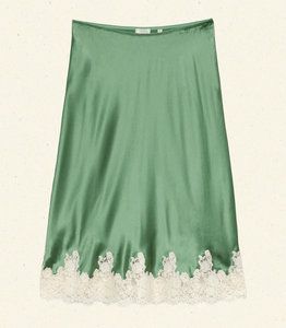 Crafted from buttery silk satin, the Elowena Skirt in Peridot by Doen offers a sophisticated silhouette with a high waist accented by elastic scallop trim for added comfort and subtle texture. Its flowing bias cut ensures graceful movement, while the detailed contrast floral lace at the hem elevates the design with refined elegance. Ideal for pairing with the Kira Top, this skirt merges classic craftsmanship with contemporary style for a polished, expert look.