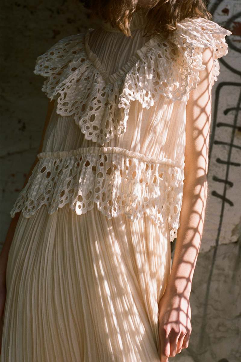 Indulge in luxury with the Cream Elise Eyelet Top by SEA. Featuring flutter sleeves and oversized eyelet detailing, this pleated top exudes elegance and sophistication. Perfect for any occasion, it effortlessly elevates your style. Add it to your wardrobe for a touch of exclusivity.