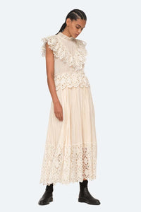 Indulge in luxury with the Cream Elise Eyelet Top by SEA. Featuring flutter sleeves and oversized eyelet detailing, this pleated top exudes elegance and sophistication. Perfect for any occasion, it effortlessly elevates your style. Add it to your wardrobe for a touch of exclusivity.