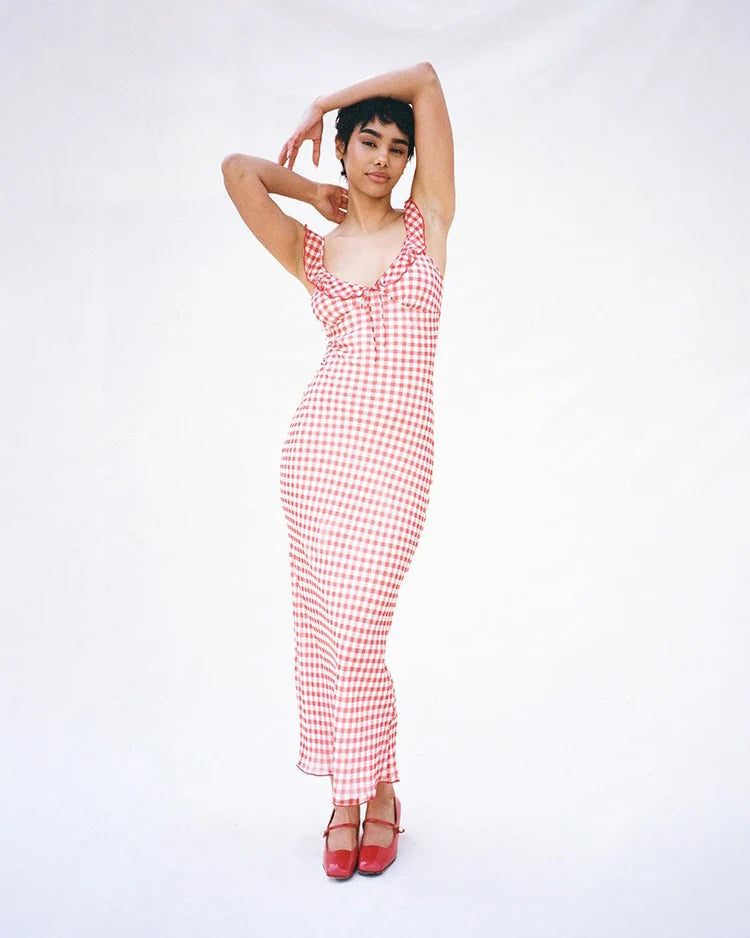 Add a touch of sweetness and playfulness to your wardrobe with the Heidi Dress in gingham. Featuring a charming frilled neckline, non-adjustable bust tie, and adjustable straps for the perfect fit. Fully lined and slip on style for easy wearability. Feel confident and carefree in this must-have dress!