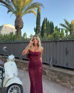 Indulge in the luxurious and alluring Margot Lace Dress. Made from vintage-inspired lace in a deep Wine shade, Margot exudes elegance and allure. Featuring a floor length maxi with a split, adjustable gold fastenings, and a semi-sweetheart neckline, she is designed to flatter your figure. Lined at the bust for coverage and support, Margot is the timeless and sheer look you need for any special occasion.