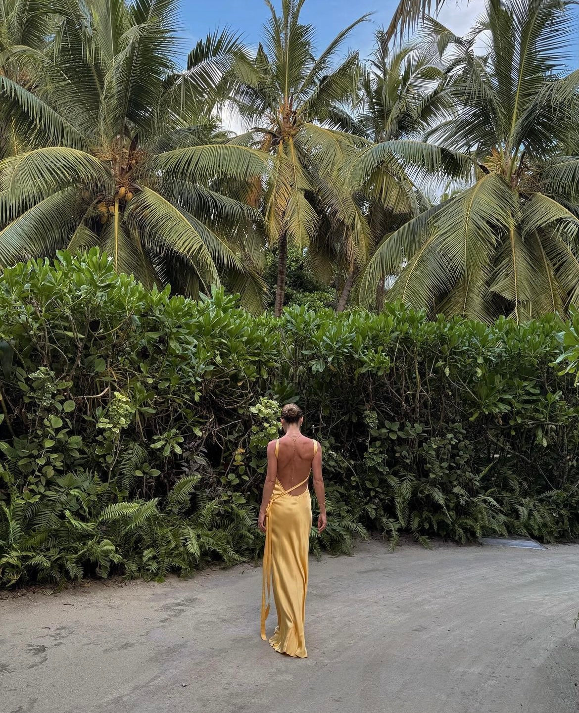 Elevate your presence and ignite your senses with the Monique Dress by Arcina Ori. This floor-length, bias-cut gown boasts a luxurious rich yellow hue that accentuates your curves. With an asymmetrical one-shoulder design, striking open back, and crossover detailing, Monique is crafted to embrace the feminine form.