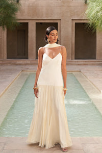 The Fia Maxi Dress embodies relaxed elegance with its timeless silhouette and flowing drop-waist design. Crafted to move gracefully with you, it drapes gently over the body for a flattering and effortless fit that never clings. Perfect for those seeking understated sophistication and comfort in one seamless piece.