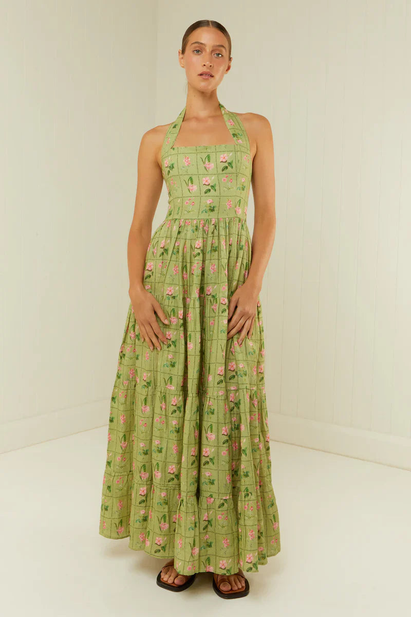 Expertly crafted from premium linen, the Willow Midi Dress by Palm Noosa is a must-have for any fashion-forward wardrobe. Its halter neck design and flowing full skirt flatter the figure, while an elasticated panel in the back ensures a comfortable and customized fit. Perfect for any occasion, this dress is adorned with our exclusive Green Floral Tile print. See our size and fit guide for more details.