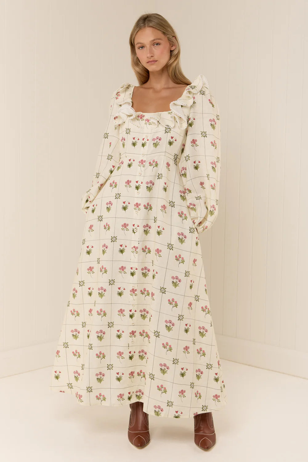 The Montana Dress in our exclusive Flower Ceramics print is expertly crafted from premium linen, combining comfort with refined style. It features a fitted bust and waist that enhance your silhouette, flowing into an elegant A-line skirt. The design includes subtle mock center-front button detailing, full-length sleeves, and a carefully tailored square neckline for a sophisticated finish. Consult our size and fit guide to ensure the perfect fit tailored to your measurements.