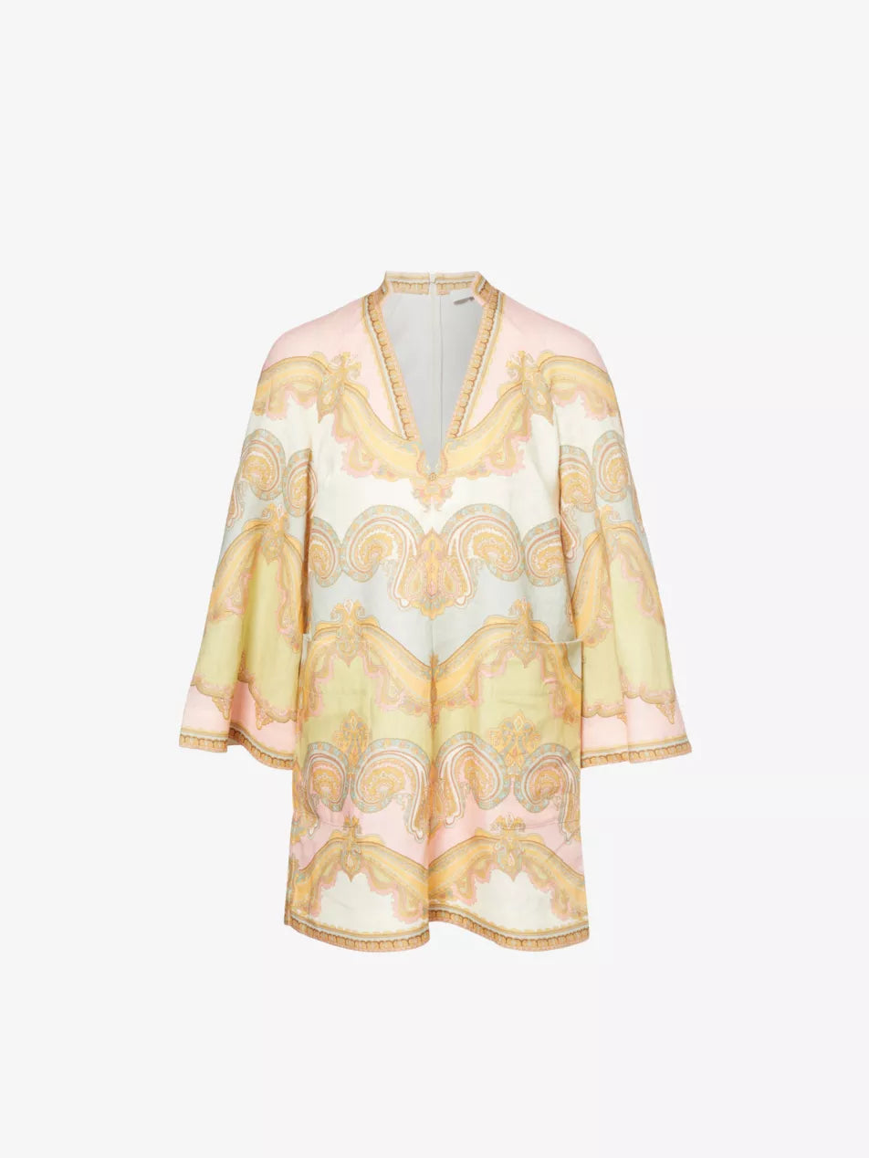 The Maxine Paisley-Pattern Tunic Linen Mini Dress by Zimmermann features tiers of breathable linen, delicate paisley embroidery, and vibrant prints that create a graceful, feminine look. Perfect for both beach days and stylish outings, its ruffled details add subtle elegance while keeping comfort in mind. Elevate your wardrobe effortlessly with this versatile dress that blends romantic charm with everyday sophistication.