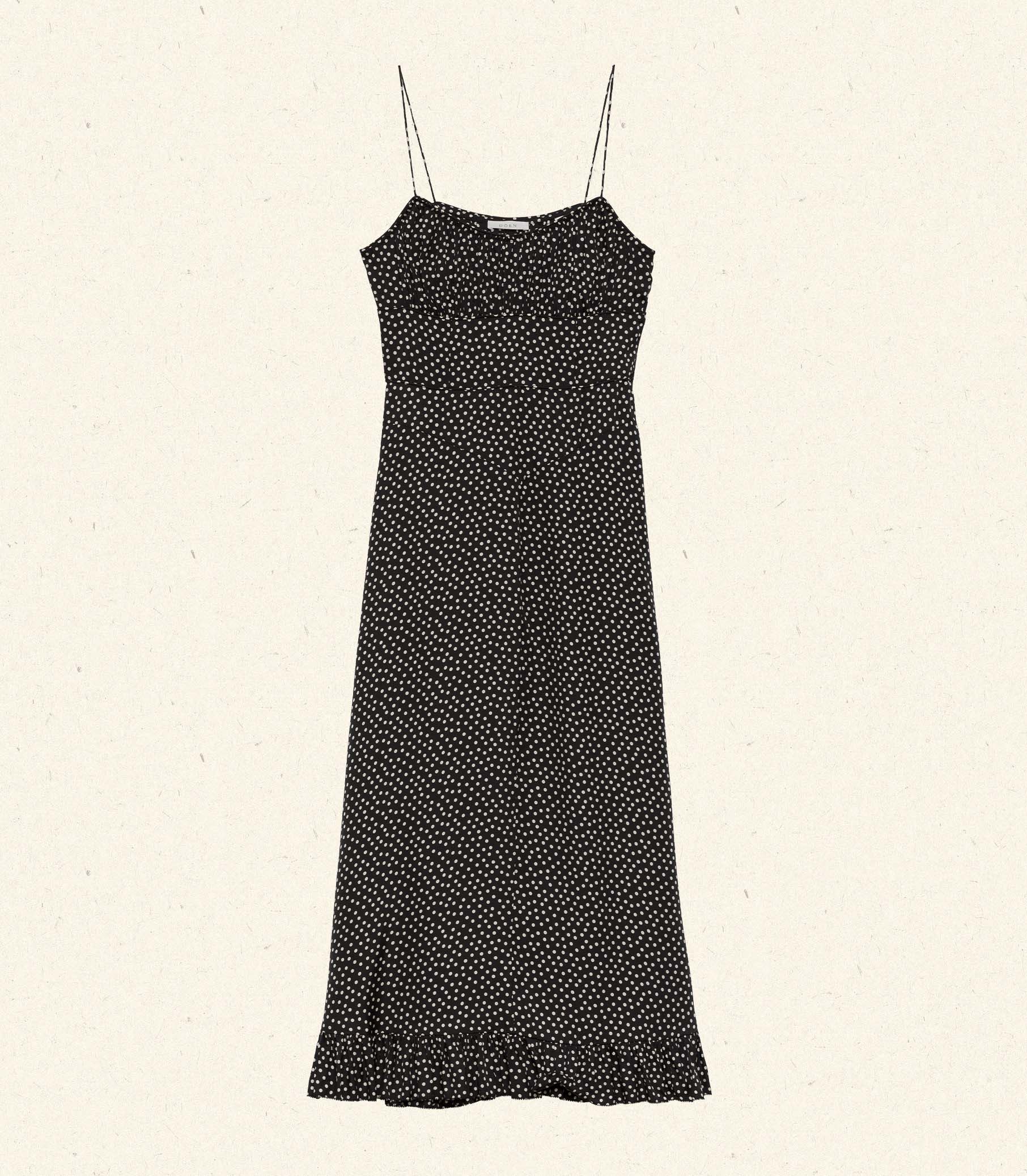 DÔEN's Rosaria Dress in Camille Dot features thoughtfully arranged polka-dot silk-blend panels that accentuate your silhouette with a subtle 'V' shape at the waist. The gathered bust and delicate pin-thin shoulder straps enhance the feminine form, while the ruffled hem adds dynamic movement. Designed to flatter with precision, this midi dress combines elegance and effortless sophistication for a refined, expert finish.
