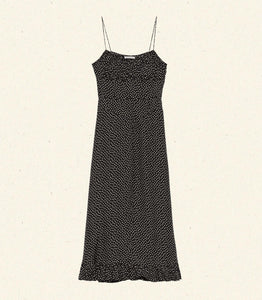 DÔEN's Rosaria Dress in Camille Dot features thoughtfully arranged polka-dot silk-blend panels that accentuate your silhouette with a subtle 'V' shape at the waist. The gathered bust and delicate pin-thin shoulder straps enhance the feminine form, while the ruffled hem adds dynamic movement. Designed to flatter with precision, this midi dress combines elegance and effortless sophistication for a refined, expert finish.
