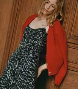 DÔEN's Rosaria Dress in Camille Dot features thoughtfully arranged polka-dot silk-blend panels that accentuate your silhouette with a subtle 'V' shape at the waist. The gathered bust and delicate pin-thin shoulder straps enhance the feminine form, while the ruffled hem adds dynamic movement. Designed to flatter with precision, this midi dress combines elegance and effortless sophistication for a refined, expert finish.