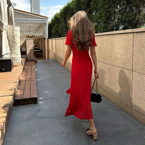 Effortlessly elegant and chic, the Mathilde Midi Dress is a must-have for any fashion-forward woman. Its contrast single breasted design, knitted fabric, and delicate hollow out details make this dress a statement piece. Embrace your feminine side with this high street dress that exudes confidence and sophistication.