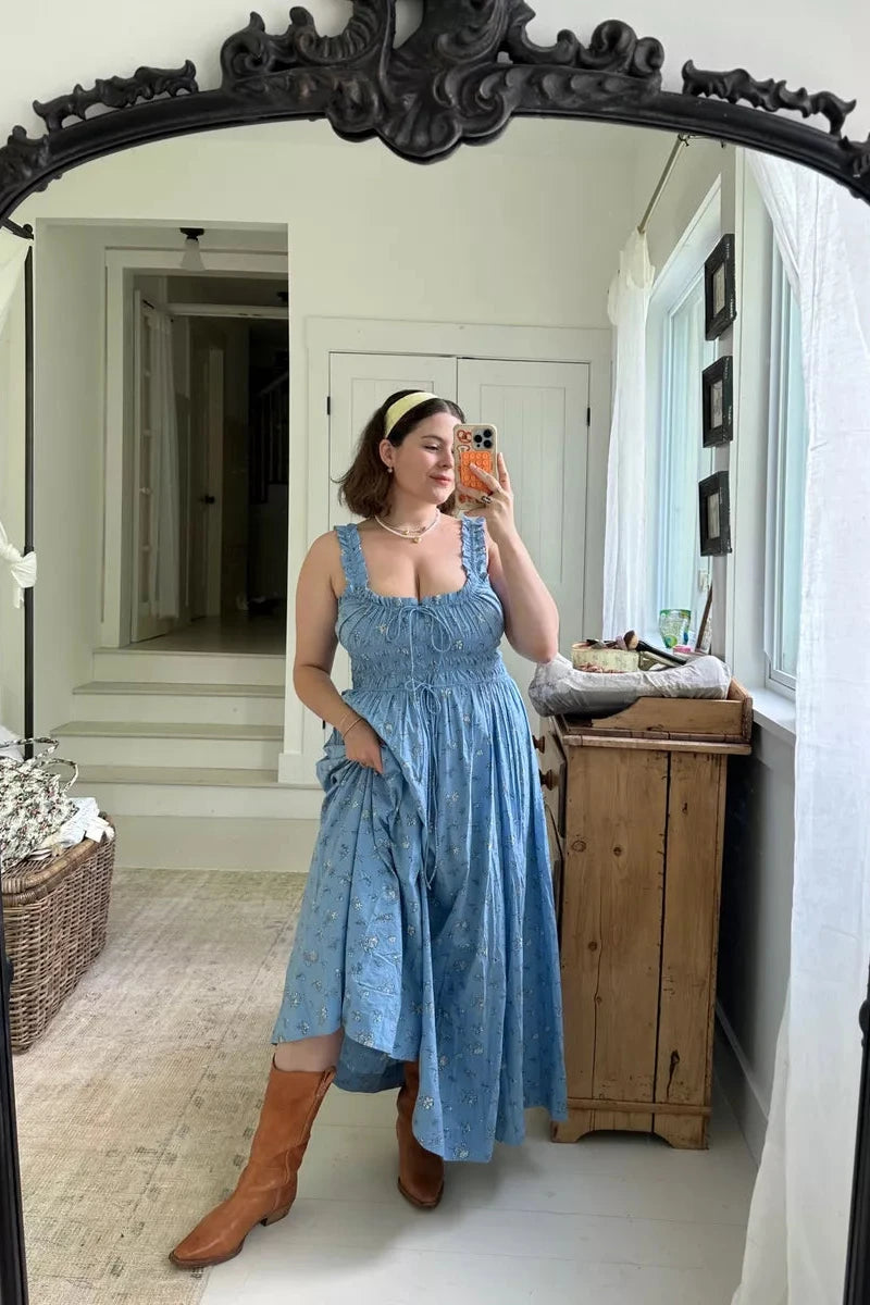 Introducing the Emaretta Dress, made of certified organic cotton. With an adjustable tie neckline, gathered bust, and smocked bodice, this lightweight dress is both comfortable and stylish. The full, ankle-grazing skirt is perfect for any summer occasion.