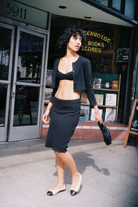 The Slip Skirt by Cou Cou Intimates offers a fresh take on a timeless silhouette, expertly designed for comfort and movement. Crafted to enhance your daily wardrobe, it features a delicate flounce hem and scalloped picot trim that add subtle charm. The petite baby bow at the center front adds a refined touch, while the pull-on style ensures effortless wear. Ideal for graceful twirls or casual days, this skirt balances elegance with ease.
