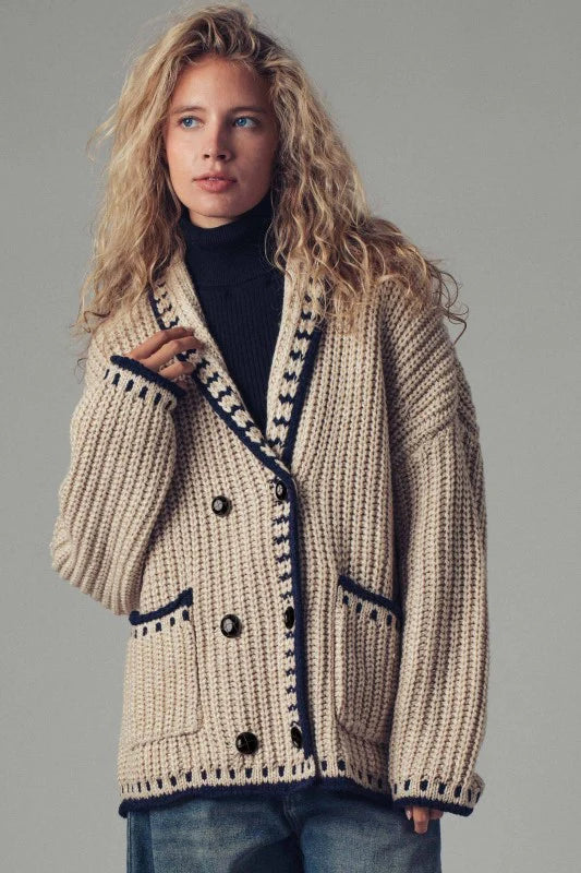 Embrace effortless layering with this boho-inspired chunky knit cardigan, designed for versatile styling. The relaxed silhouette and deep front pockets make it equally at home over a dress, denim vest, or as part of a coordinated set. Crafted from soft, heavyweight yarn, this piece delivers substantial warmth without sacrificing comfort, making it an essential addition to any transitional wardrobe. Perfect for creating dimension in your outfits while maintaining that coveted relaxed aesthetic.