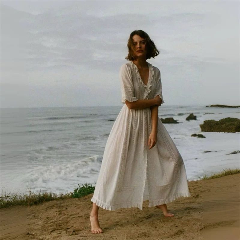 Expertly crafted from the softest organic cotton voile, the Ellora Dress by Doen is an elegant choice for any special occasion. Featuring a plunging V-neckline, cascading lace-trimmed ruffles, intricate embroidery, and delicate lace detailing, this Victorian-inspired maxi dress exudes romance and sophistication. Hand-crocheted buttons and a fitted waist accentuate the silhouette, flowing into an ankle-grazing skirt finished with a ruffle. Elevate your style with the Ellora Dress.