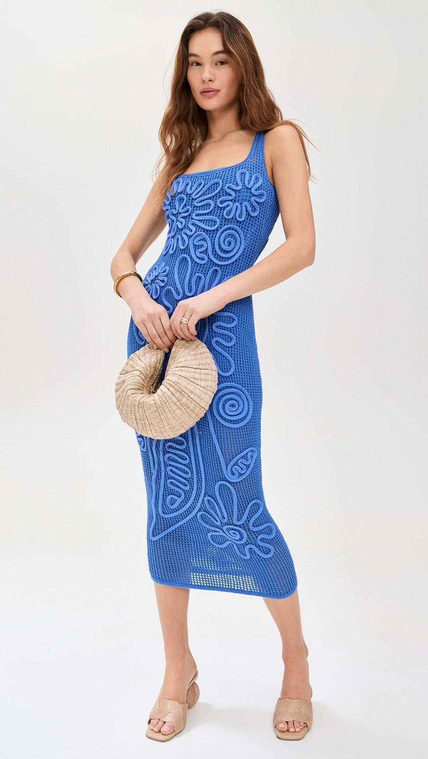 Crafted from mid-weight stretch crochet, the Nissa Knit Dress by Cult Gaia offers a comfortable fit with subtle elasticity. Its corded floral detailing adds refined texture and visual interest, while the midi length delivers elegant coverage. Featuring a square neckline and a seamless pullover design, this dress combines effortless wearability with sophisticated styling. Ideal for those seeking a balance of structure and flexibility in a distinctive, expert-crafted piece.