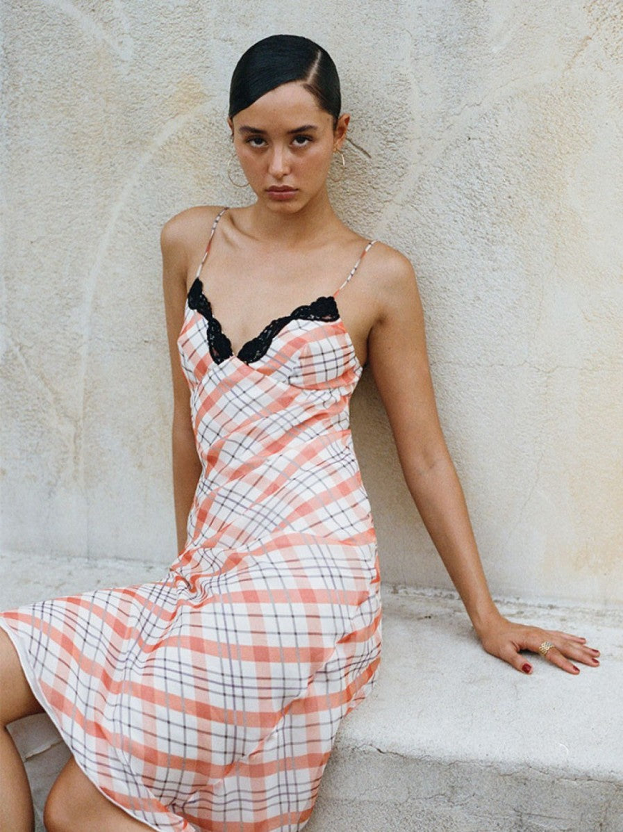 Experience the ultimate in summer elegance with The Karlie in Summer Check by Realisation Par. This double layered dress features delicate lace detailing, ankle-grazing length, and a timeless printed check. With no zipper, it's effortless to slip on and pair with your favorite accessories. From Amalfi to New York, turn heads in this chic, versatile piece.