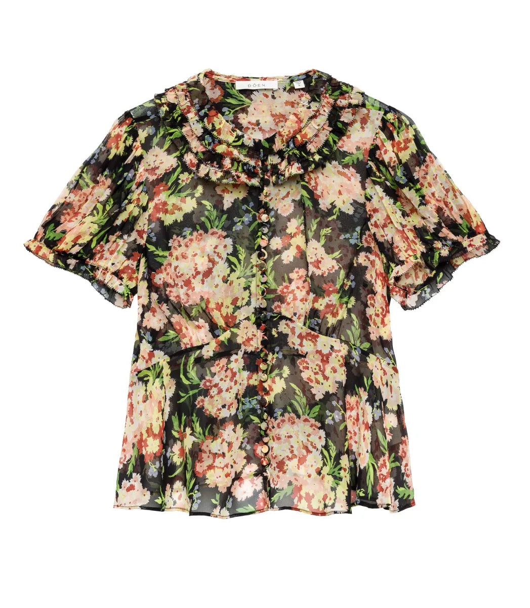 The Alona Top by Doen offers timeless sophistication with its light silk georgette fabric and 1930s-inspired design. Featuring short puffed sleeves and a Peter Pan collar adorned with delicate picot-edged ruffles, this blouse highlights a shirred bust that flows into a breezy, slightly cropped silhouette with a bias-cut hem. Self-covered buttons along the front enhance its refined charm. 