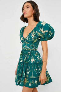 The Esmeralda Manzanilla Mini Dress combines effortless style with comfort, crafted from breathable 100% cotton poplin. Its adjustable deep-v neckline with a delicate drawstring ensures a custom fit, while the hand-embroidered waistline adds a refined artisanal touch. Featuring a concealed back zip for a seamless silhouette, this dress is perfect for warm days and tropical evenings. Elevate your look by pairing it with espadrilles or heels and statement jewelry for a polished, vibrant outfit.