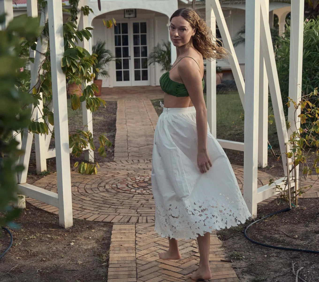 Experience timeless elegance with the Georgina Skirt by Doen. Crafted from organic cotton poplin, this high-waisted A-line skirt features delicate floral embroidery cutwork at the hem for an antique-inspired touch. Convenient side fastenings and a full silhouette falling just above the ankle make this skirt a perfect pairing with the Madison Top.