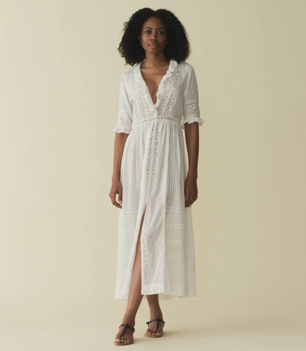 Infuse your wardrobe with timeless elegance and modern charm with the Rosabella Dress by Doen. Crafted from the softest organic cotton voile, this maxi dress features a plunging V-neckline and delicate details such as lace-trimmed ruffles, pintucks, and bow embroidery. Perfect for any occasion, embrace vintage-inspired style with a touch of luxurious comfort.