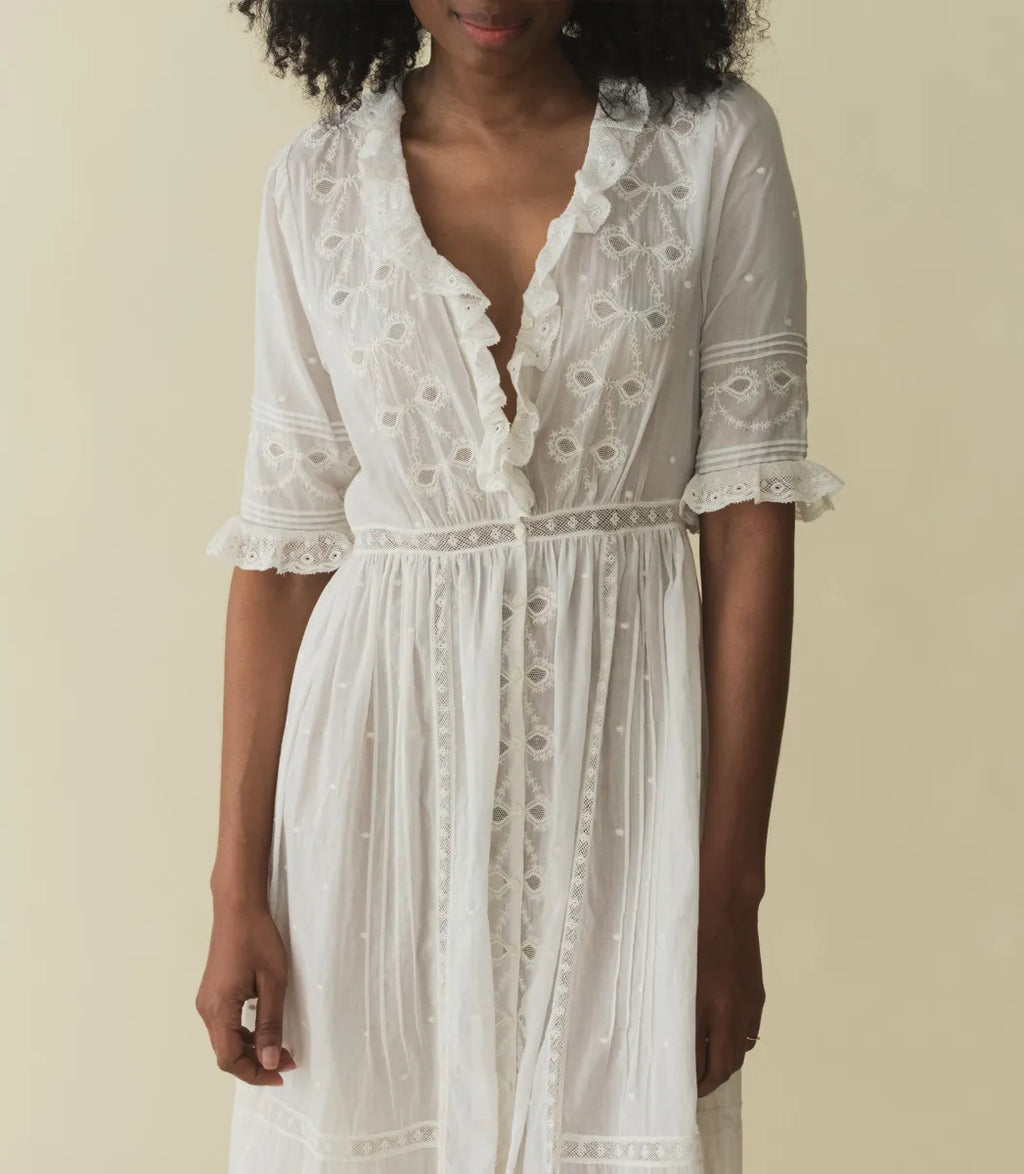 Infuse your wardrobe with timeless elegance and modern charm with the Rosabella Dress by Doen. Crafted from the softest organic cotton voile, this maxi dress features a plunging V-neckline and delicate details such as lace-trimmed ruffles, pintucks, and bow embroidery. Perfect for any occasion, embrace vintage-inspired style with a touch of luxurious comfort.