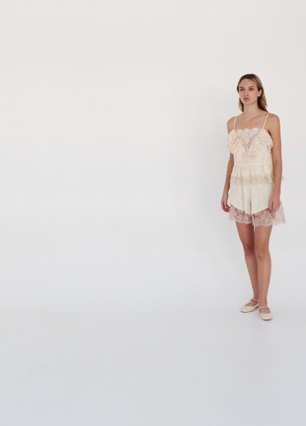 Discover timeless elegance with the Ethel Camisole, a versatile piece adorned with delicate floral patterns and luxurious lace details. The v-neckline is beautifully framed by a lace overlay, while a matching lace hem adds refined texture. Adjustable straps provide a custom fit for all-day comfort. Whether layered under your favorite top or worn as a standalone piece, this sophisticated camisole effortlessly elevates your everyday style.