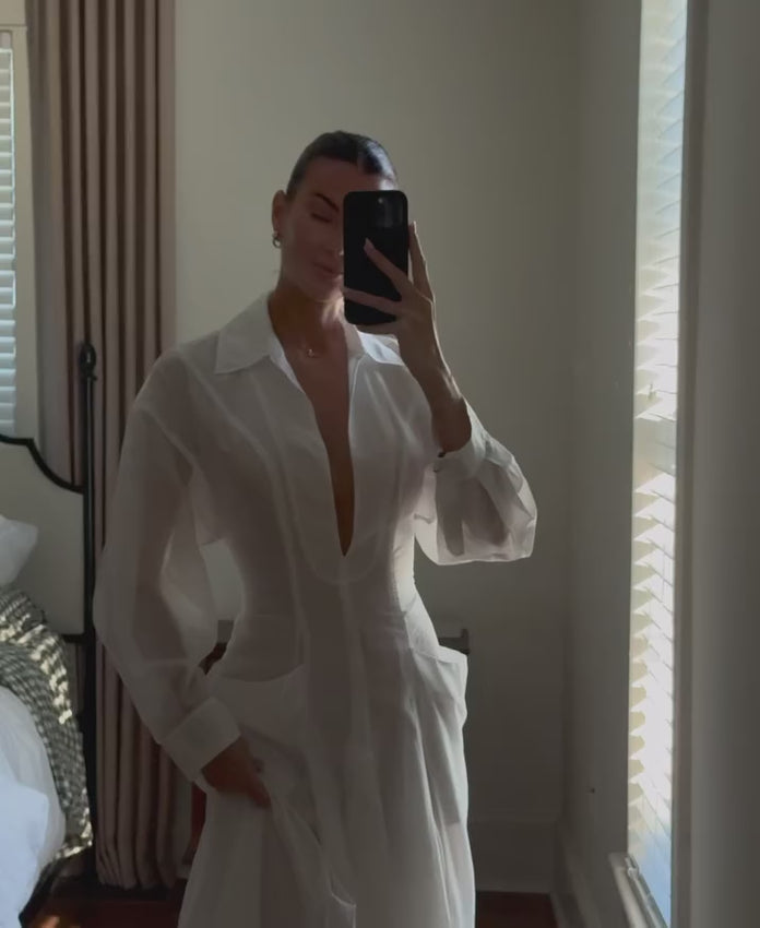 Effortless elegance meets practical comfort in this midi dress. Crafted from lightweight voile fabric, it features a partially lined silhouette with a charming back tie-up accent for a flattering fit. The pull-on styling makes dressing simple, while buttoned cuffs add a polished touch. Functional side pouch pockets keep your essentials close. Perfect for warm days and versatile enough to transition from casual to dressed-up occasions.