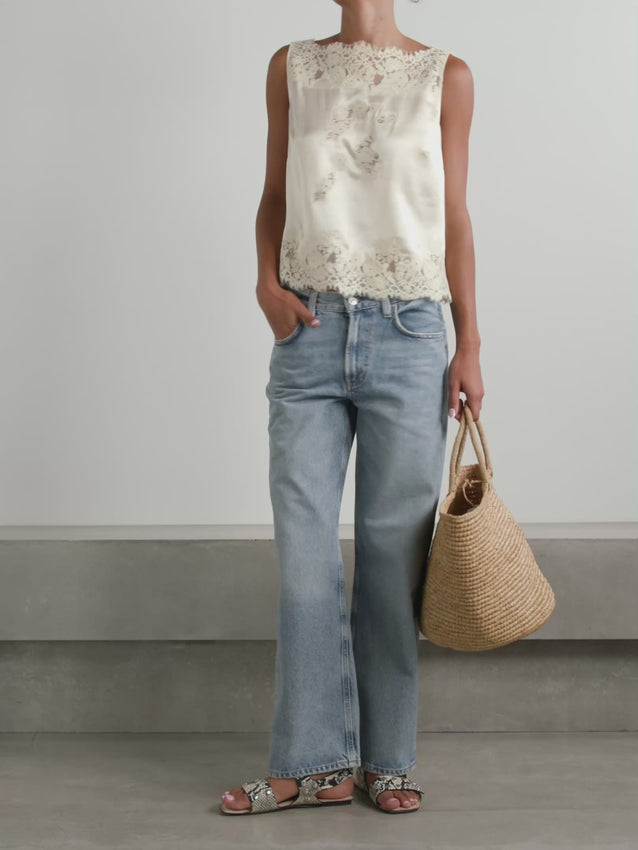 Crafted from luxuriously soft silk satin, the Viviane Top combines effortless elegance with refined details. Its relaxed, boxy cut flatters all silhouettes while the high bateau neckline frames the shoulders beautifully. Intricate floral lace adorns the neckline, bodice, and hem, adding a touch of romantic sophistication. Perfect for layering or wearing solo, this versatile piece transitions seamlessly from day to evening.
