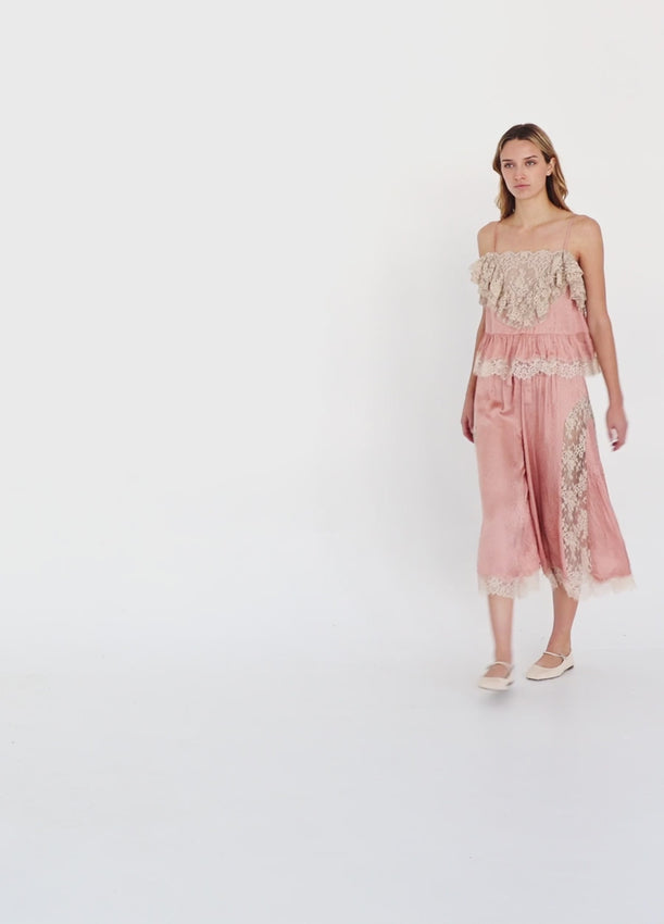 Discover timeless elegance with the Ethel Camisole, a versatile piece adorned with delicate floral patterns and luxurious lace details. The v-neckline is beautifully framed by a lace overlay, while a matching lace hem adds refined texture. Adjustable straps provide a custom fit for all-day comfort. Whether layered under your favorite top or worn as a standalone piece, this sophisticated camisole effortlessly elevates your everyday style.