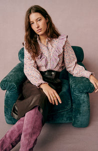 Elevate your wardrobe with the Gala Shirt by Sezane, featuring a gathered high collar that adds refined structure. Delicate ruffles cascade down the front, enhancing its elegant silhouette. The wide sleeves offer a modern, voluminous shape, expertly tailored with cuffs to provide a polished finish. This shirt combines classic detailing with contemporary design for a sophisticated, standout look.